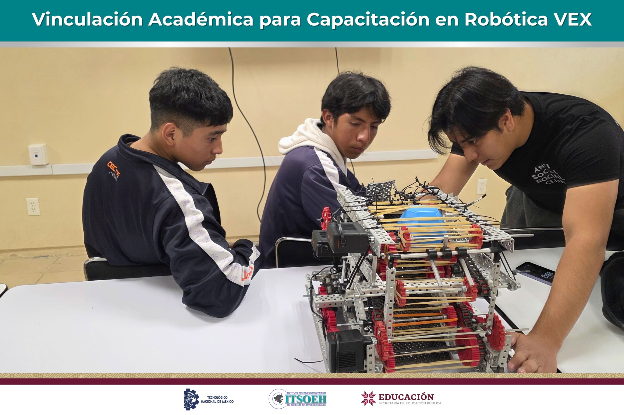 Students working hands-on with VEX robot hardware